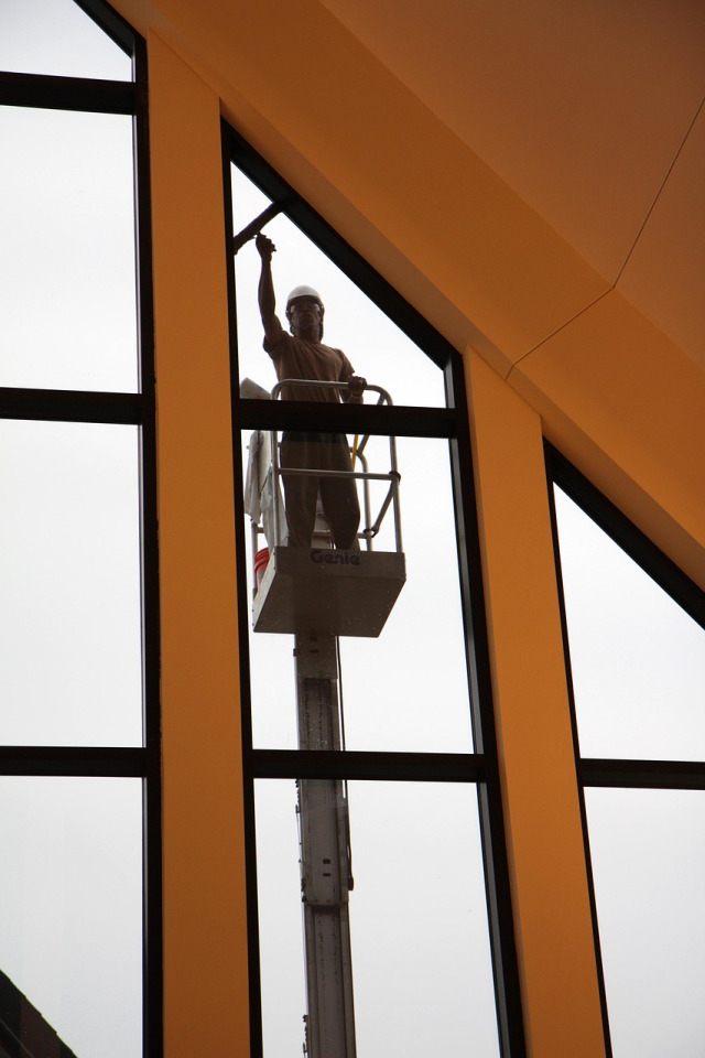 window cleaning squeegee wiping glass